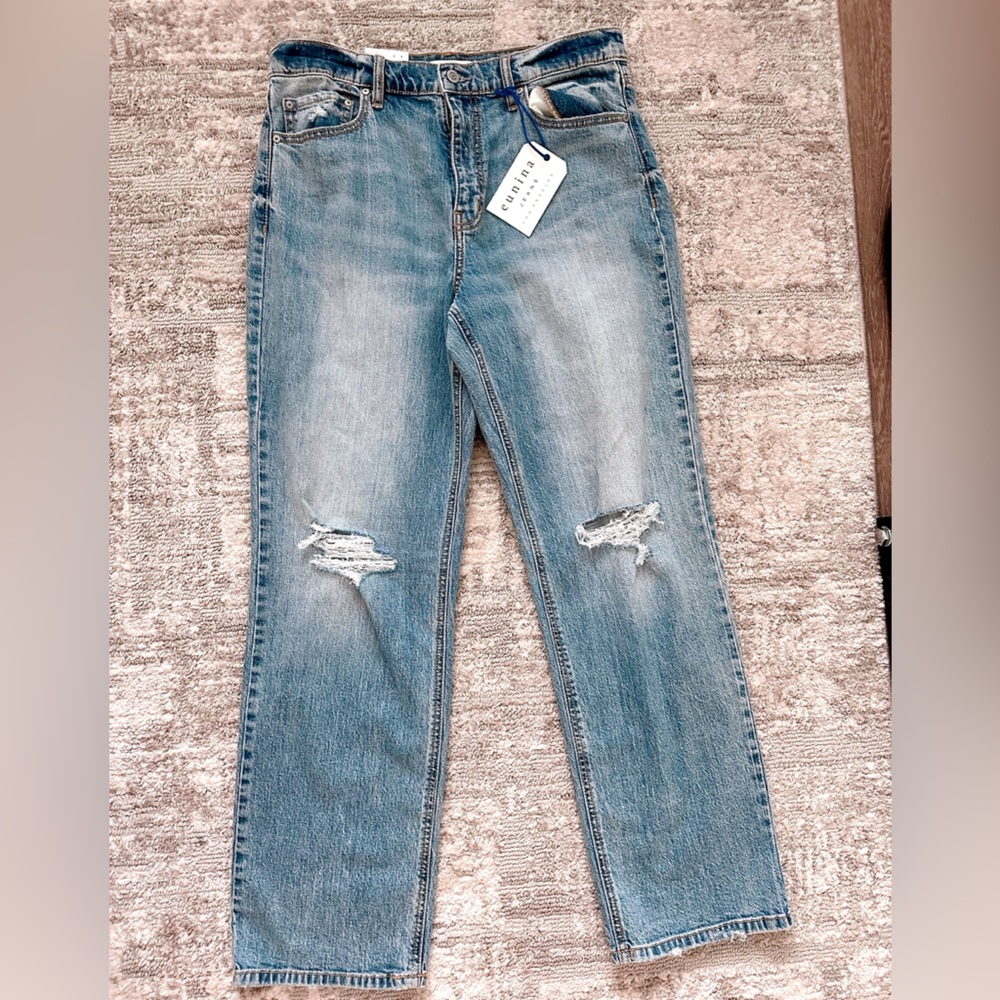 High Rise Medium-Light wash jeans.